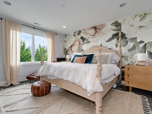 a bedroom with a bed and window