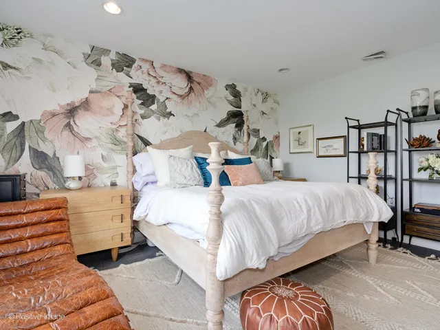 a bedroom with a bed and a dresser