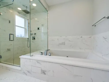 a bathroom with a bathtub and a sink
