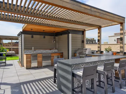a dining area with a table and chairs