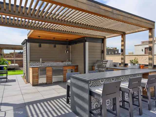 a dining area with a table and chairs