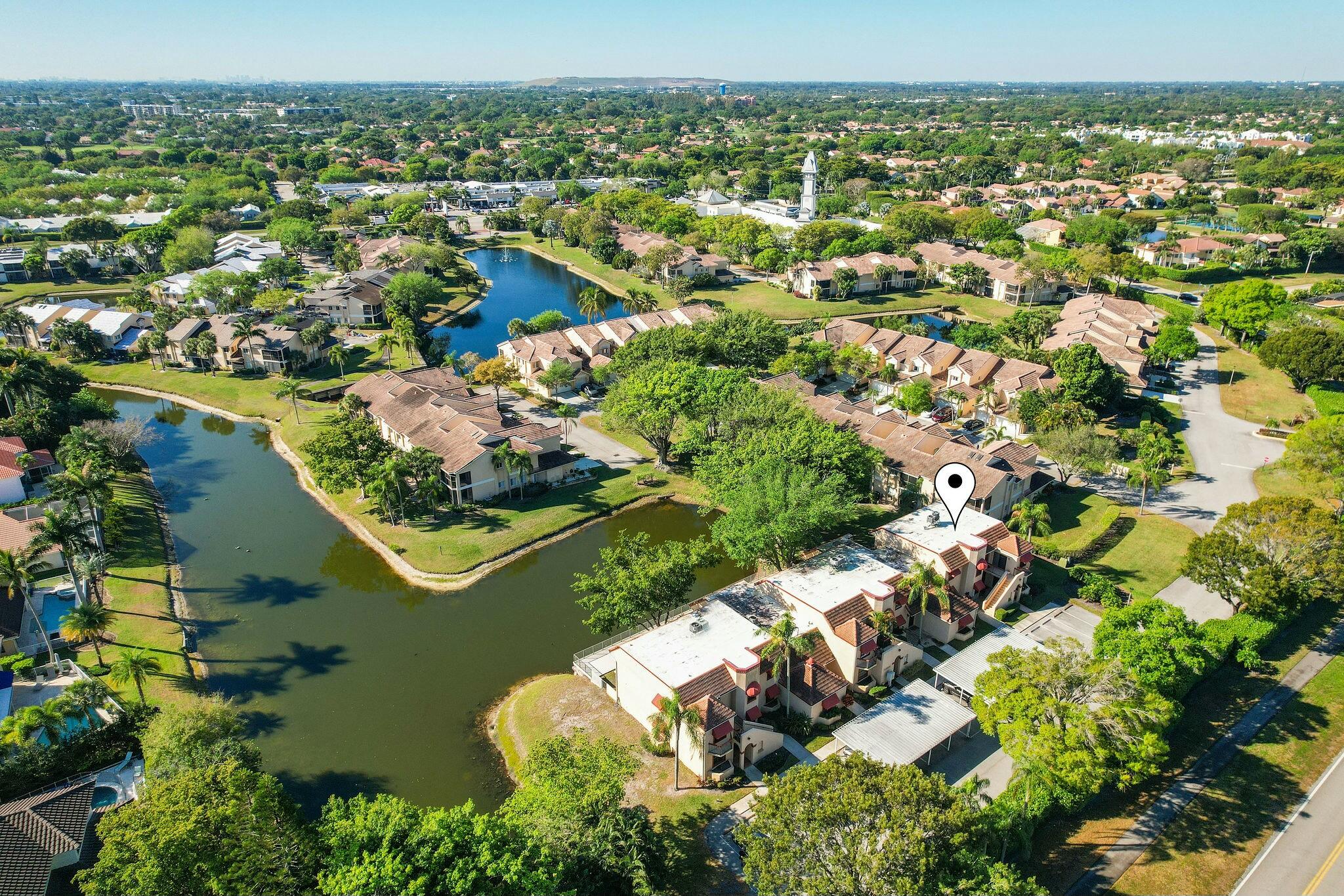 23032 Island View, Unit H Boca Raton, FL 33433 - Photo 28 of 30 an aerial view of lake residential houses with outdoor space and swimming pool