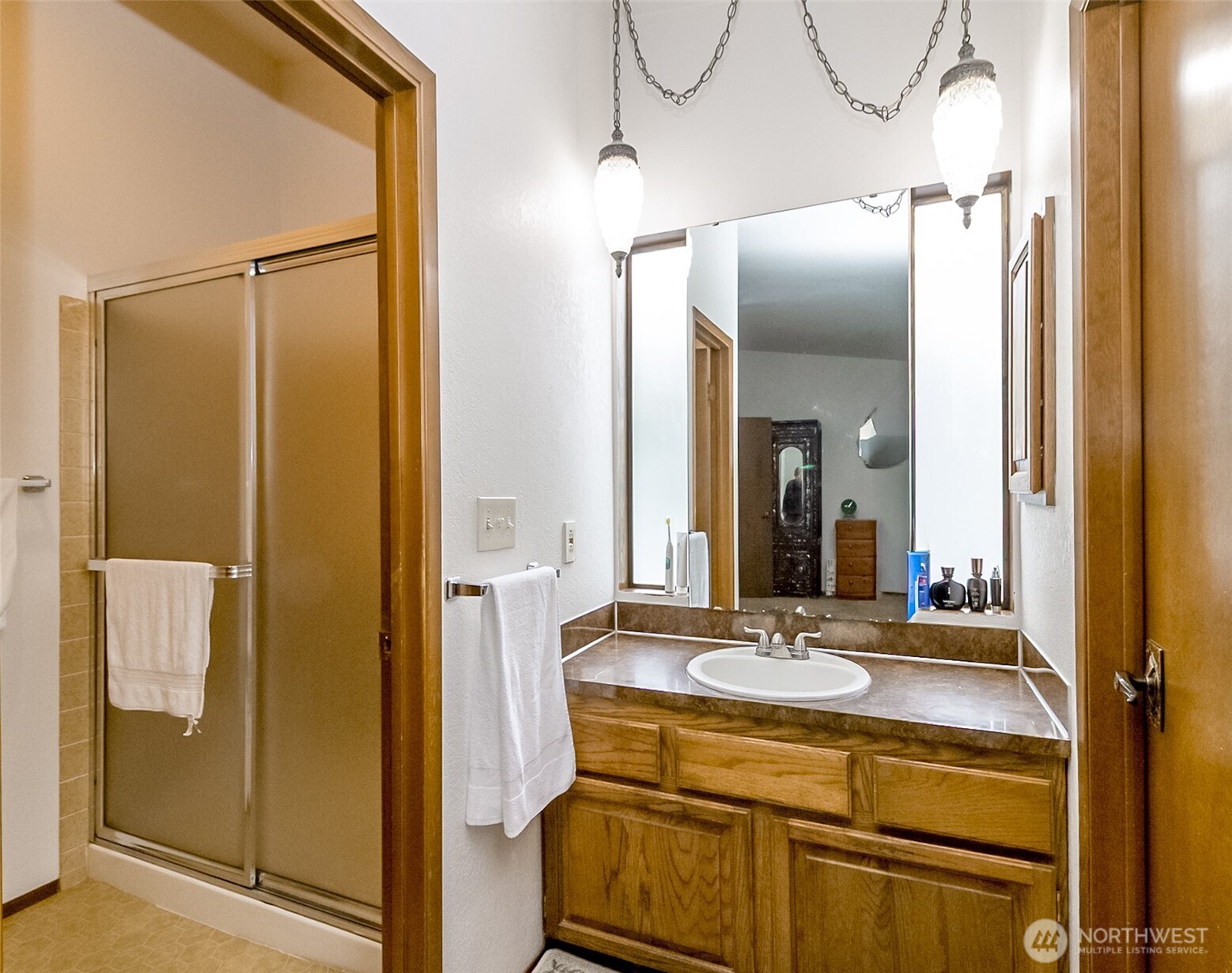 22121 4th Avenue Southeast Bothell, WA 98021 - Photo 15 of 22 a bathroom with a sink and a mirror