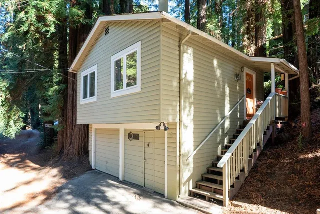 a view of backyard with small cabin
