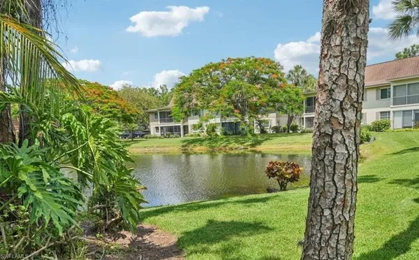 a view of a lake with a yard