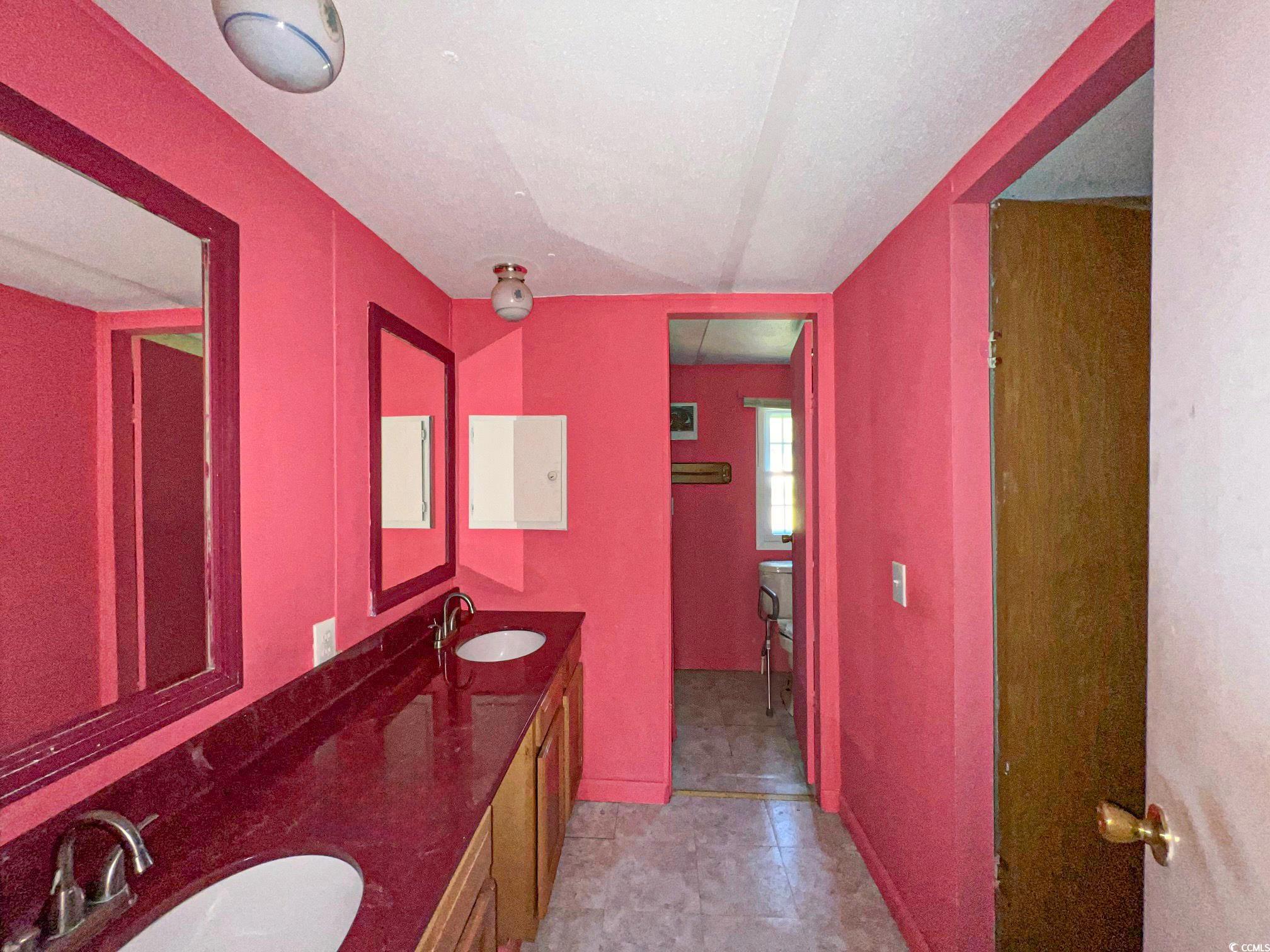 2911 Mt Olive Road Loris, SC 29569 - Photo 8 of 16 Bathroom with vanity and tile patterned floors