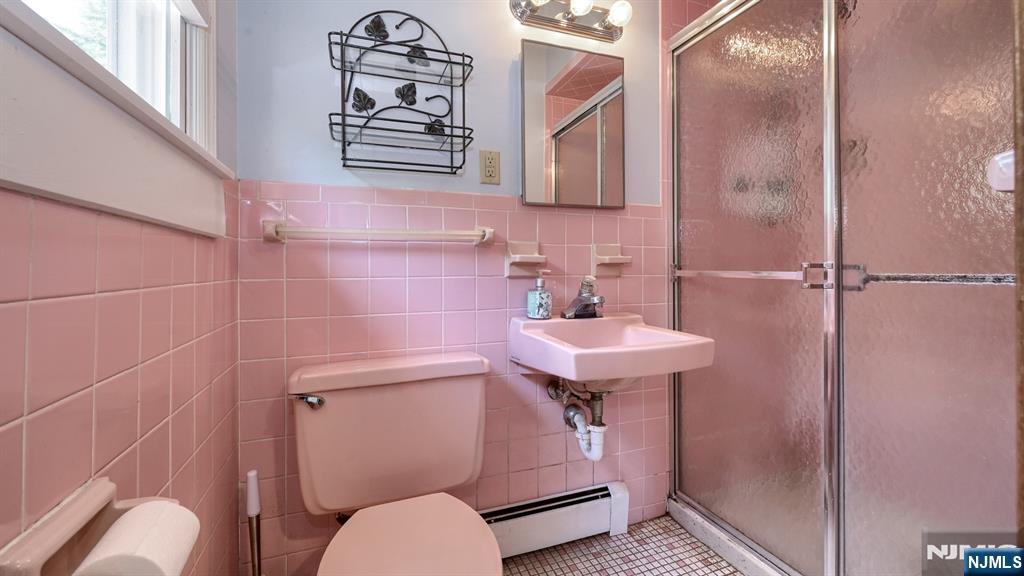 277 French Hill Road Wayne, NJ 07470 - Photo 17 of 28 a bathroom with a sink a toilet and shower