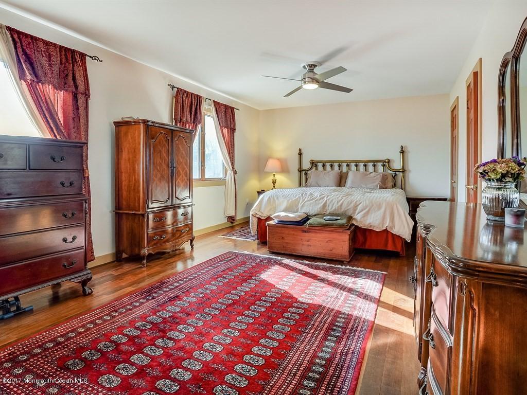 778 Adelphia Road Freehold, NJ 07728 - Photo 14 of 40 a spacious bedroom with a bed and a rug