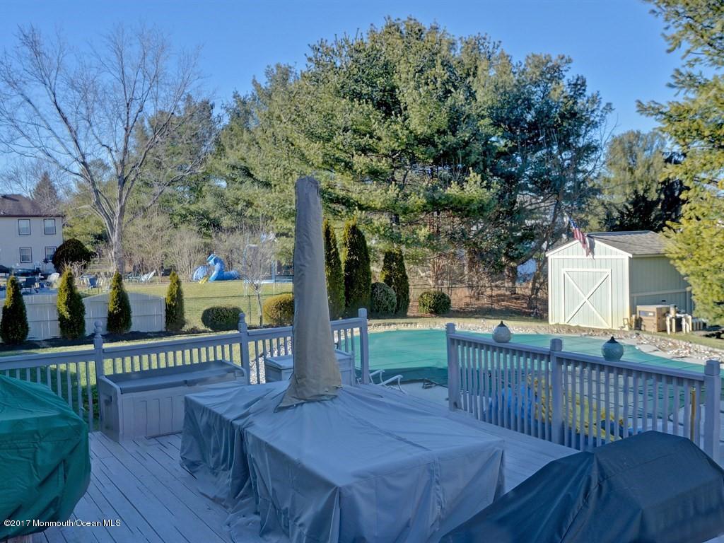778 Adelphia Road Freehold, NJ 07728 - Photo 36 of 40 a view of a deck with furniture and garden