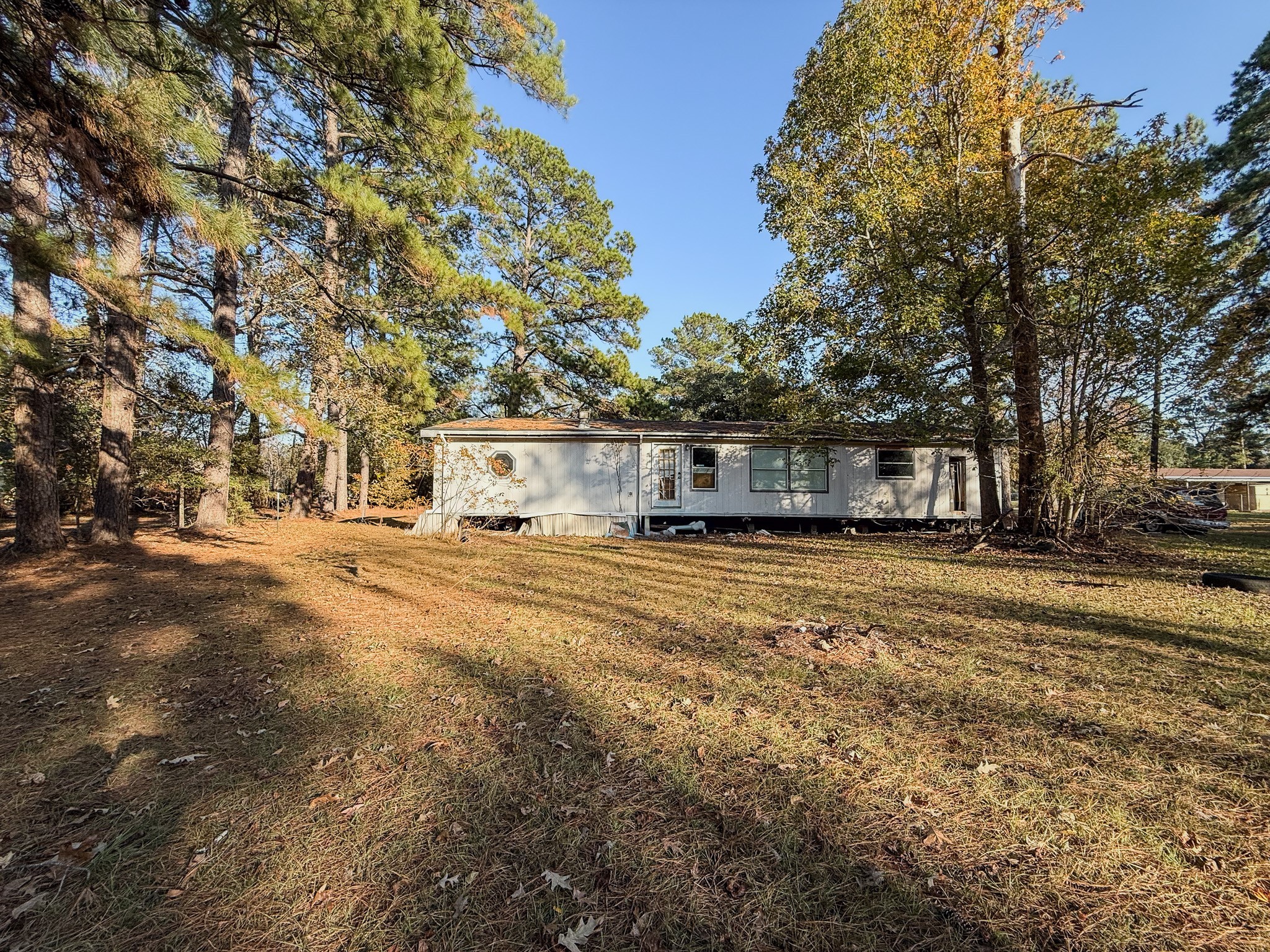 310 County Road 643 Kenefick, TX 77535 - Photo 8 of 13 a front view of a house with a yard