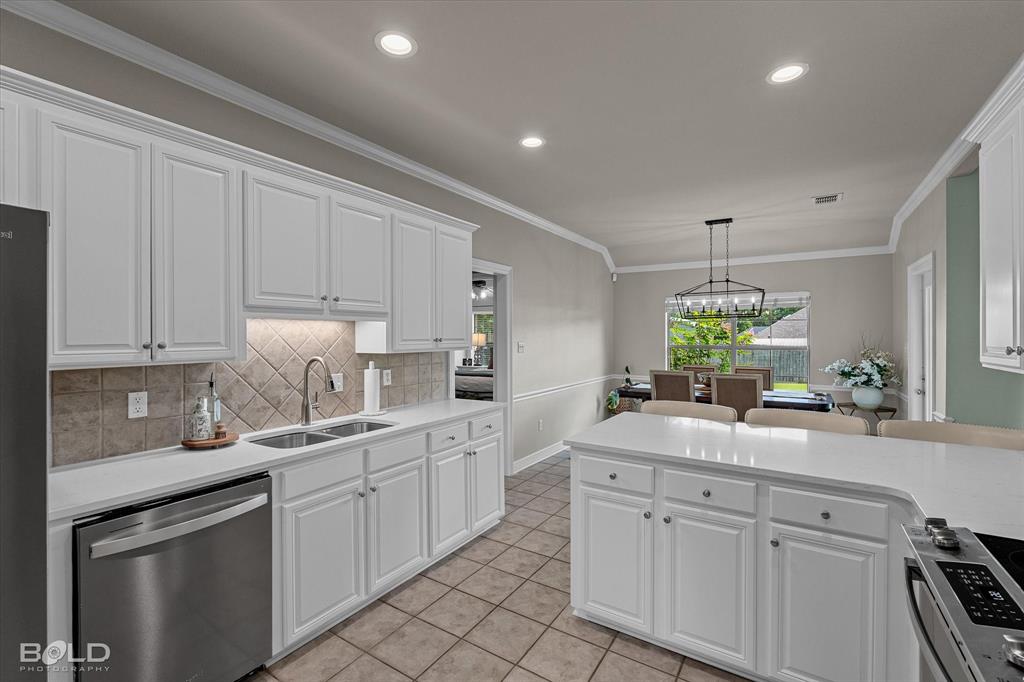 116 Augusta Avenue Benton, LA 71006 - Photo 20 of 38 a kitchen with sink cabinets and window