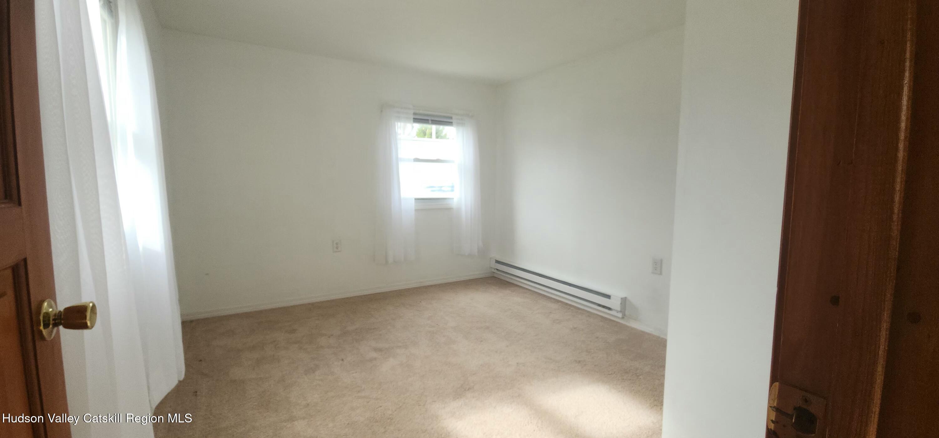 231 Stone Bridge Road Cornwallville, NY 12418 - Photo 12 of 18 a view of an empty room and a window