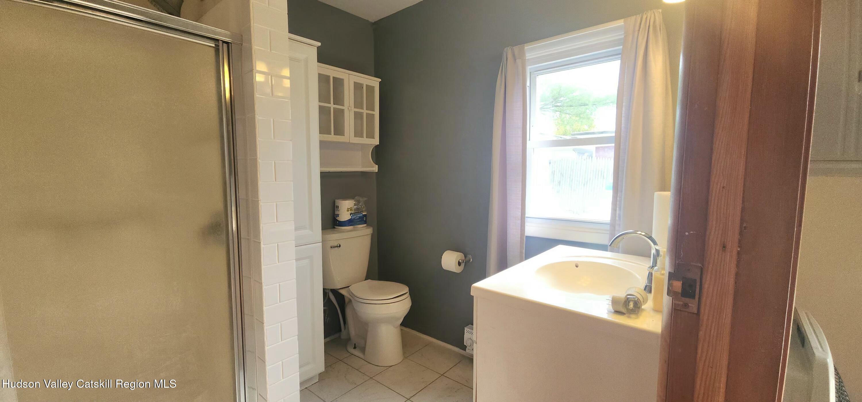 231 Stone Bridge Road Cornwallville, NY 12418 - Photo 14 of 18 a bathroom with a granite countertop sink toilet and shower