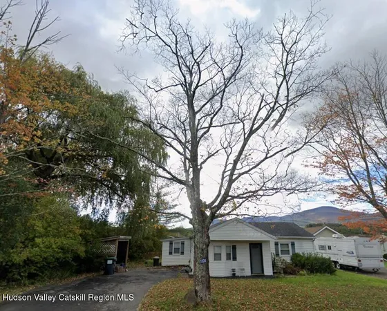 a view of house with yard