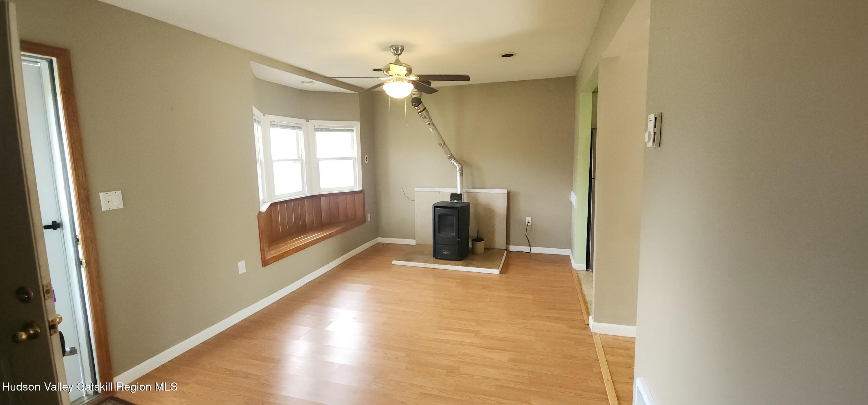 231 Stone Bridge Road Cornwallville, NY 12418 - Photo 3 of 18 a view of a hallway with wooden floor and staircase
