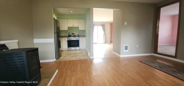 a view of a kitchen cabinets and wooden floor