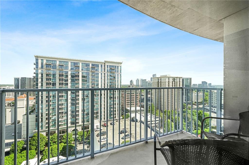 250 Pharr Road Northeast, Unit 1702 Atlanta, GA 30305 - Photo 22 of 23 a view of a balcony with a floor to ceiling window