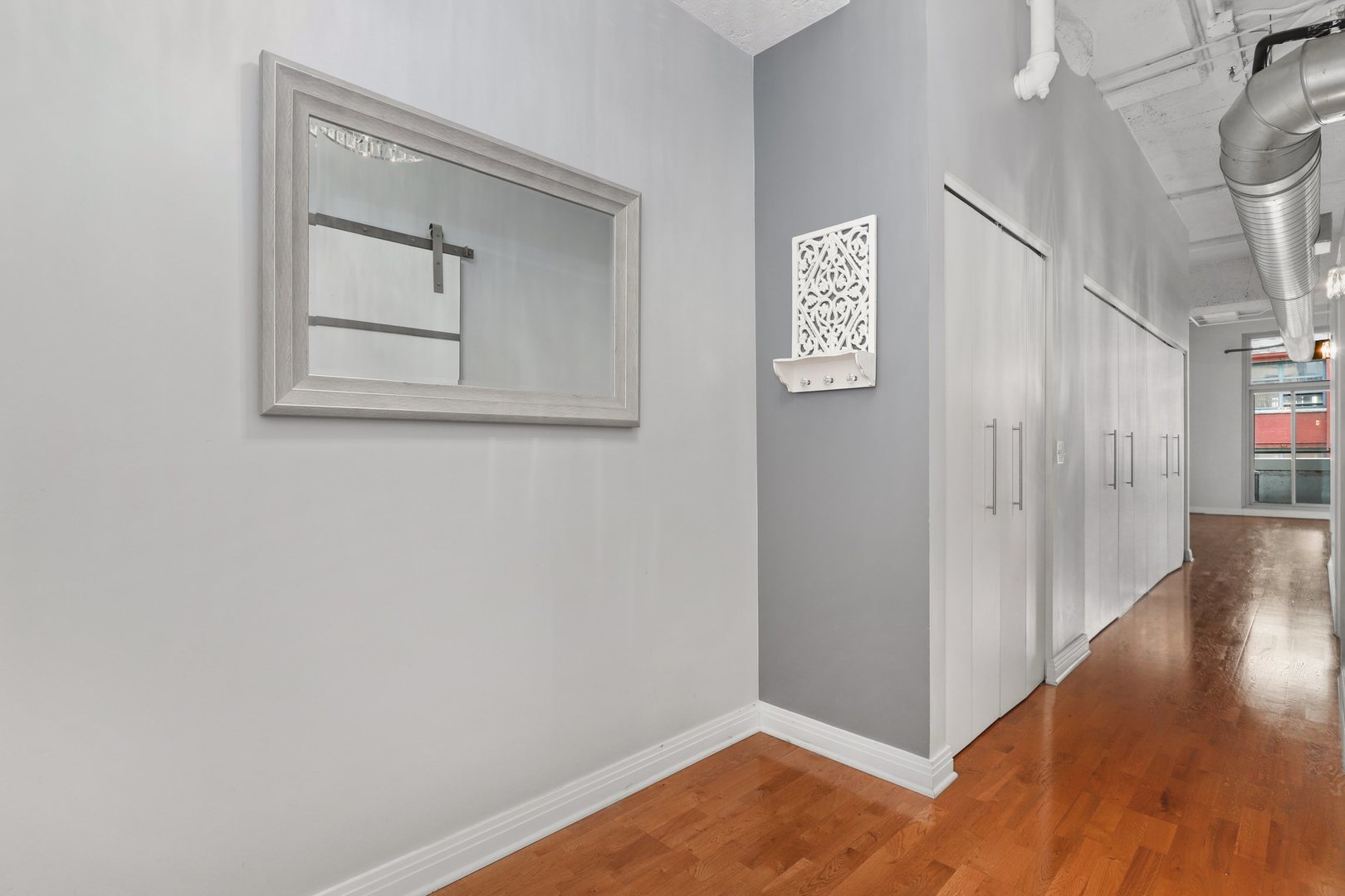 565 West Quincy Street, Unit 717 Chicago, IL 60661 - Photo 13 of 37 a view of an entryway with wooden floor