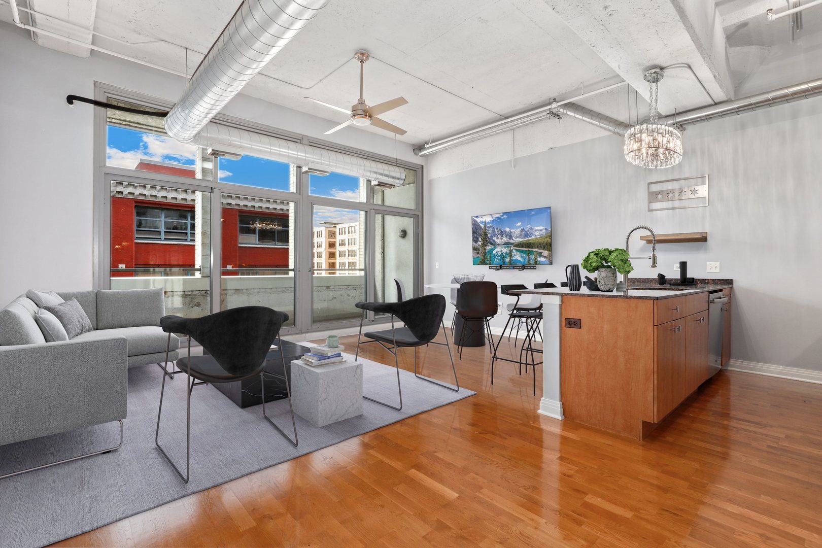 565 West Quincy Street, Unit 717 Chicago, IL 60661 - Photo 2 of 37 a living room with furniture and a large window