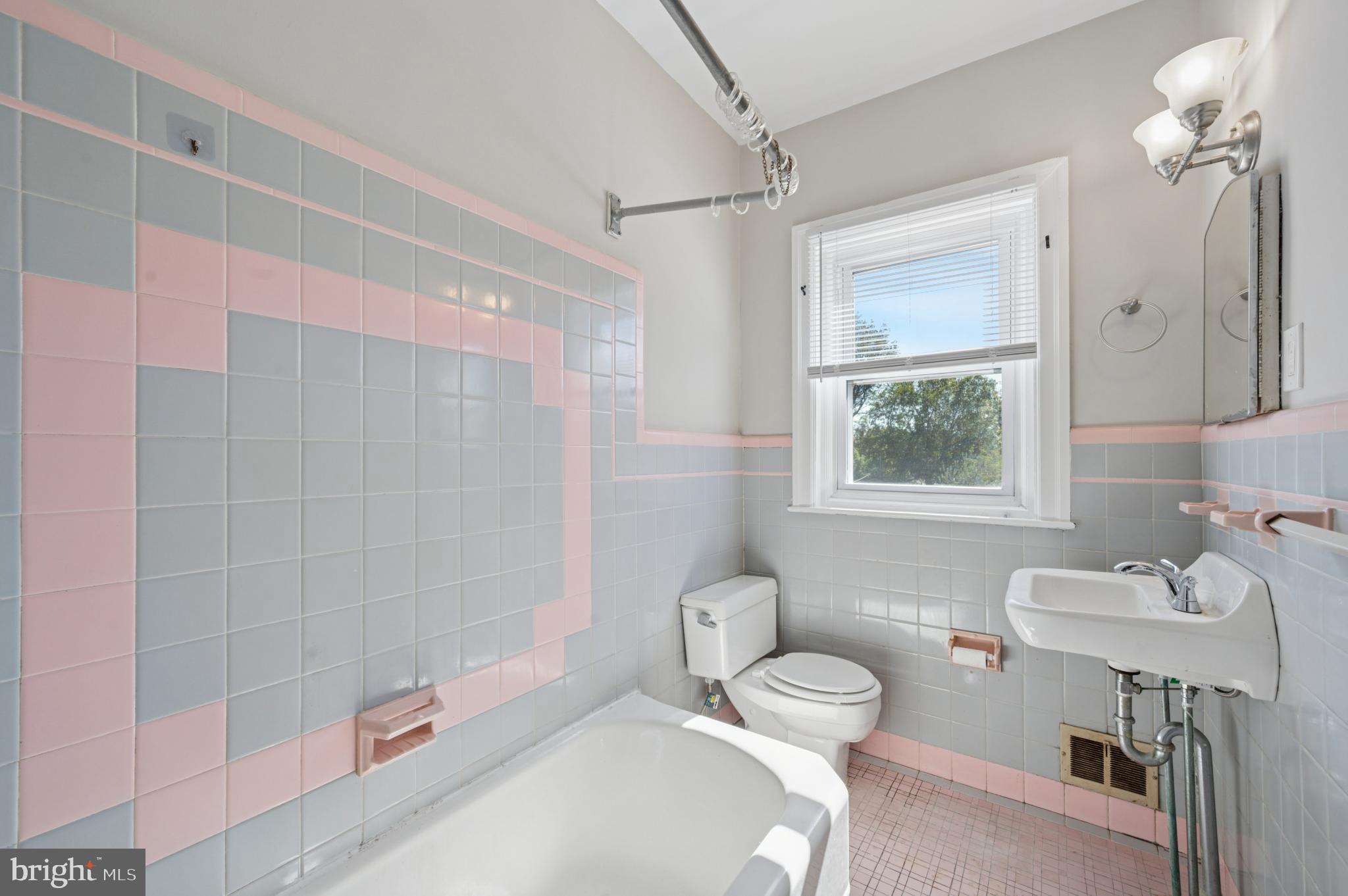 7920 West Chester Pike Upper Darby, PA 19082 - Photo 12 of 13 Charming vintage bathroom with pastel tiles.