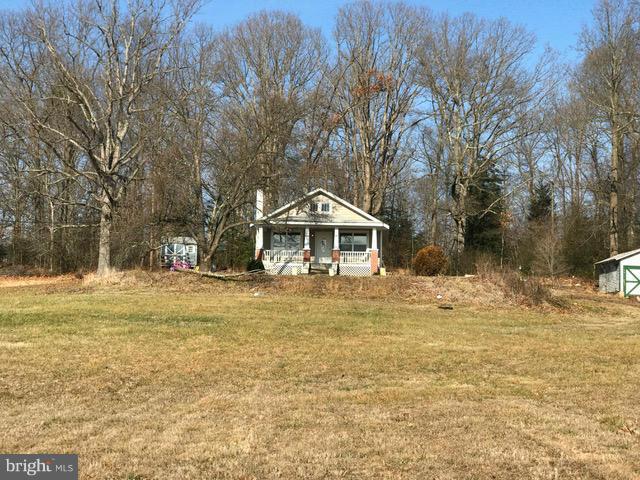 223 Forest Lane Road Fredericksburg, VA 22405 - Photo 1 of 15 a front view of a house with a yard