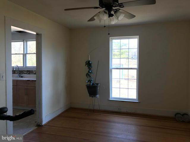 223 Forest Lane Road Fredericksburg, VA 22405 - Photo 12 of 15 wooden floor in an empty room with a window