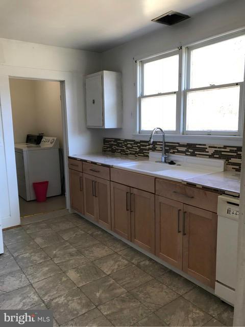 223 Forest Lane Road Fredericksburg, VA 22405 - Photo 13 of 15 a kitchen with sink cabinets and window
