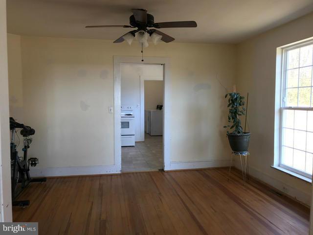 223 Forest Lane Road Fredericksburg, VA 22405 - Photo 14 of 15 wooden floor in an empty room with a window