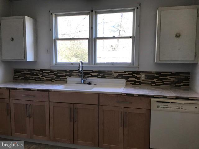 223 Forest Lane Road Fredericksburg, VA 22405 - Photo 15 of 15 a kitchen with stainless steel appliances granite countertop a sink a window and cabinets