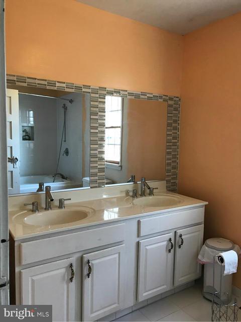 223 Forest Lane Road Fredericksburg, VA 22405 - Photo 8 of 15 a bathroom with a sink and a mirror