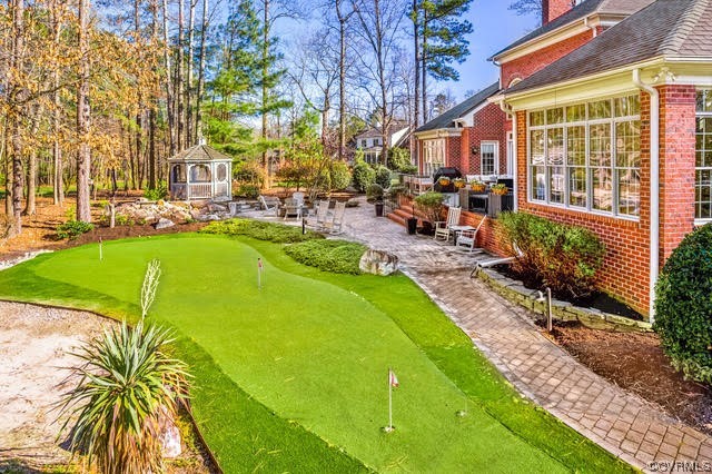 124 West Lancashire Williamsburg, VA 23188 - Photo 30 of 44 a view of a patio with couches table and chairs and potted plants