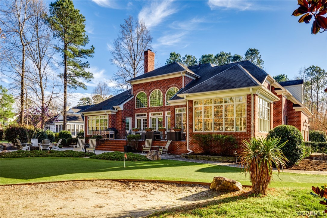124 West Lancashire Williamsburg, VA 23188 - Photo 4 of 44 a front view of a house with a yard table and chairs