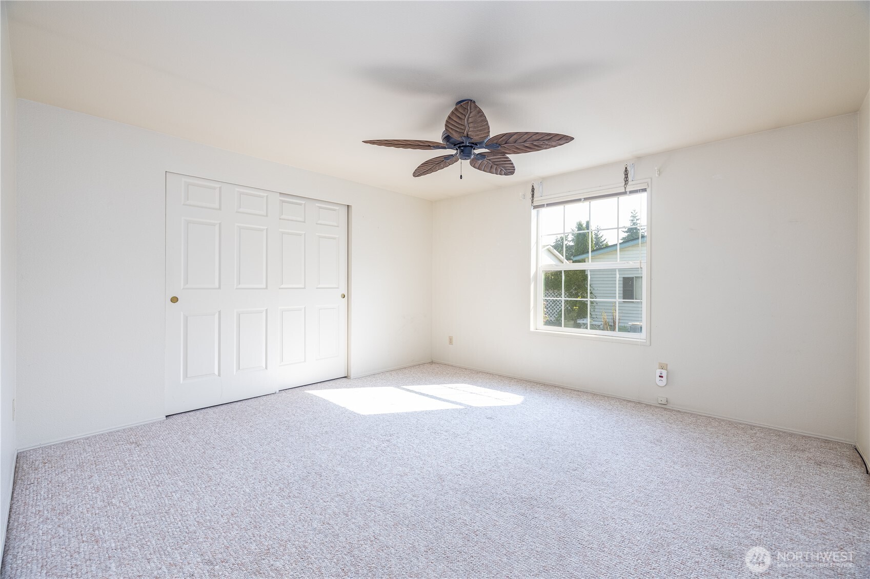 3802 James Street, Unit 82 Bellingham, WA 98226 - Photo 26 of 29 an empty room with windows and fan