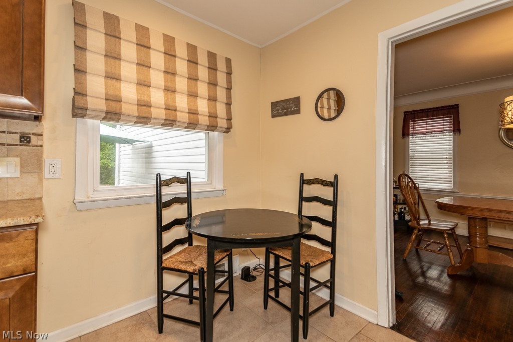 2219 Fenwick Road Cleveland, OH 44118 - Photo 11 of 32 Kitchen has room for a table and chairs with a window that overlooks the back patio.