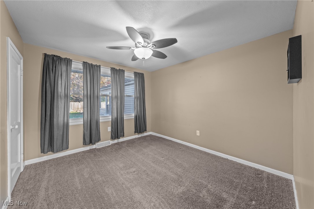 5865 Ruple Parkway Brook Park, OH 44142 - Photo 36 of 45 Spare room with carpet flooring and ceiling fan