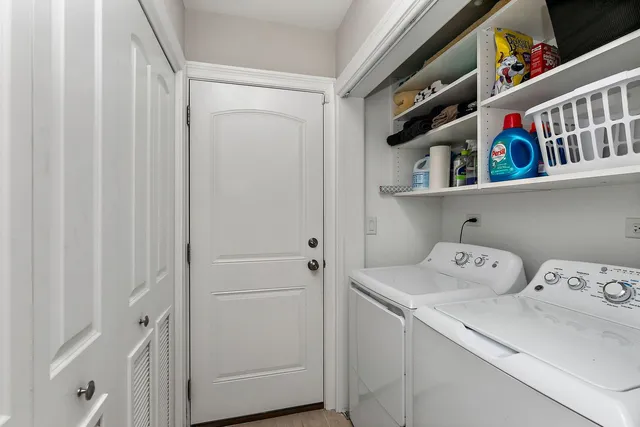 a view of storage and utility room with racks on the wall