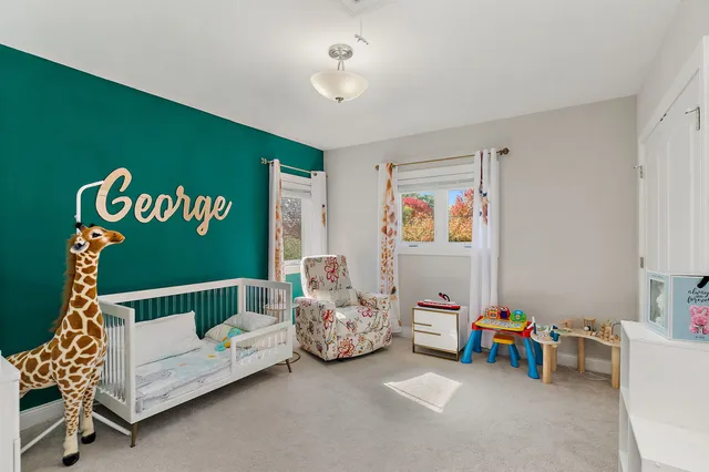 a bedroom with furniture and a window