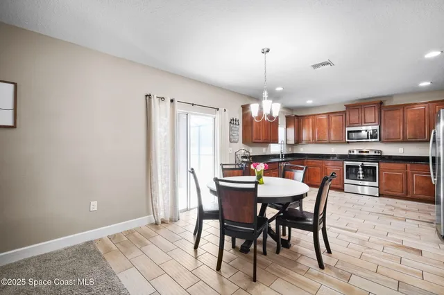 a view of a dining room with furniture