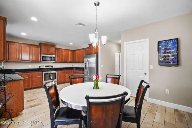 a view of a dining room with furniture