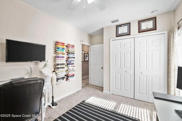 a livingroom with window and furniture