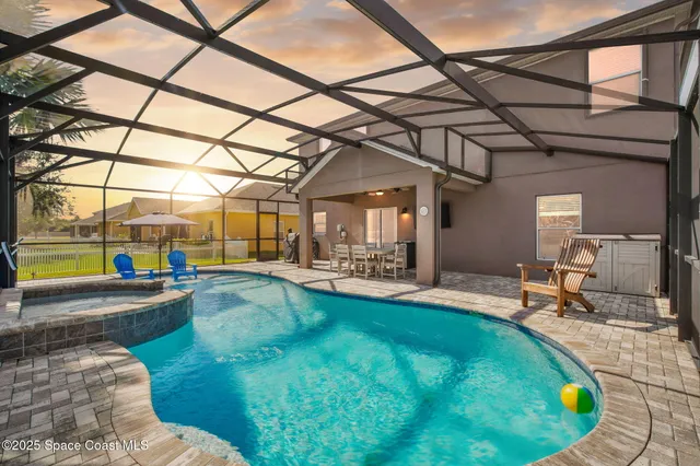 a view of a swimming pool with a patio