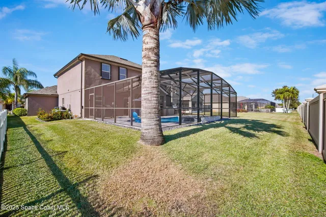 a view of swimming pool with a backyard