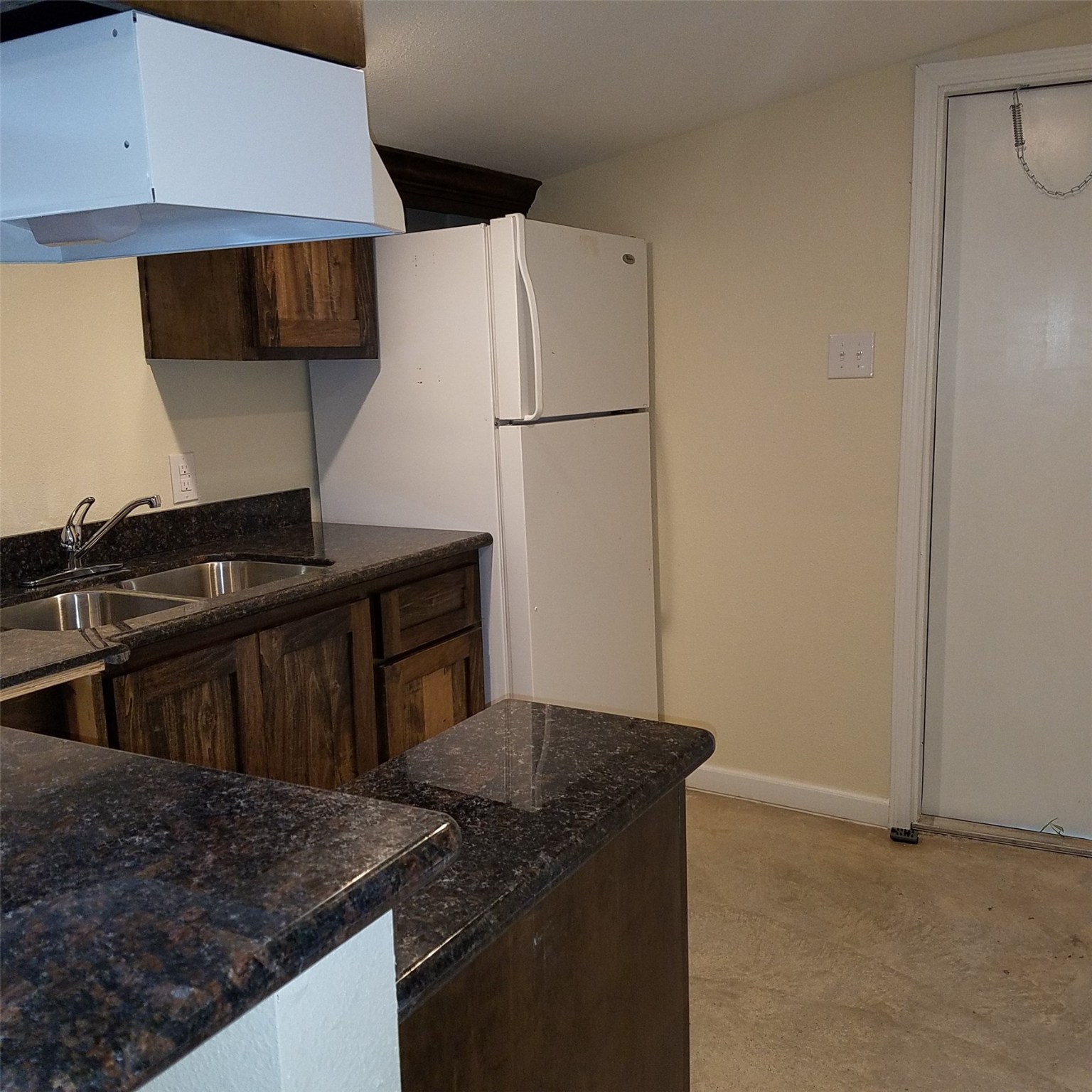 1503-2 Spur 529 Rosenberg, TX 77471 - Photo 2 of 10 a kitchen with a sink and a refrigerator