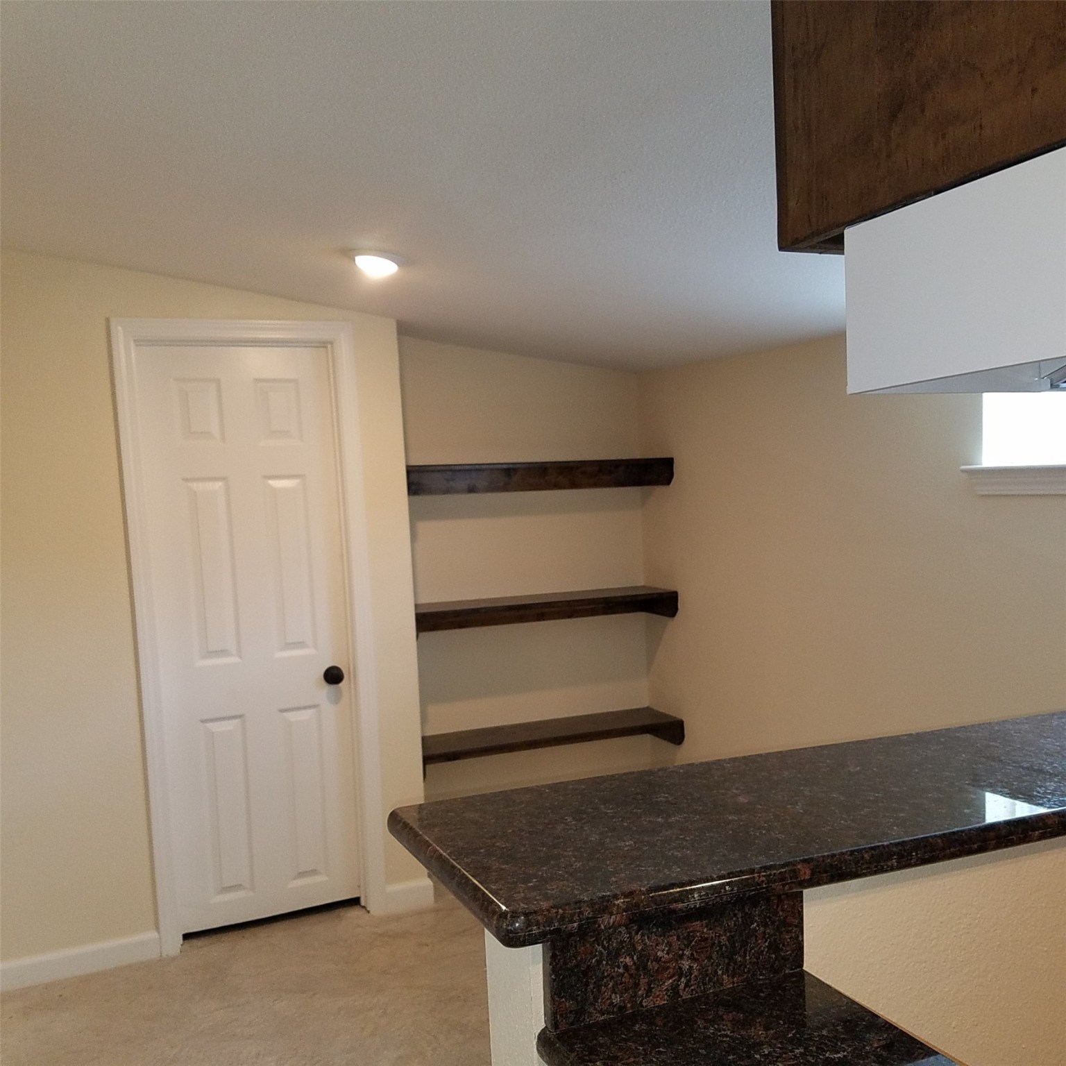1503-2 Spur 529 Rosenberg, TX 77471 - Photo 3 of 10 a kitchen with a refrigerator and cabinets