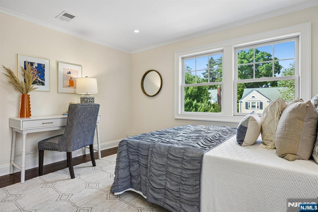 11 Mt Vernon Road Montclair, NJ 07043 - Photo 30 of 49 a bedroom with a bed and a large window