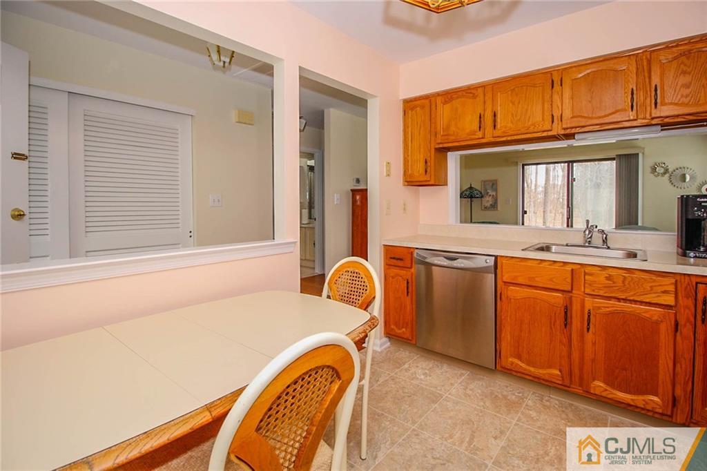 2106 Timber Oaks Road, Unit 2106 Edison, NJ 08820 - Photo 11 of 25 a bathroom with a sink a mirror and a bathtub