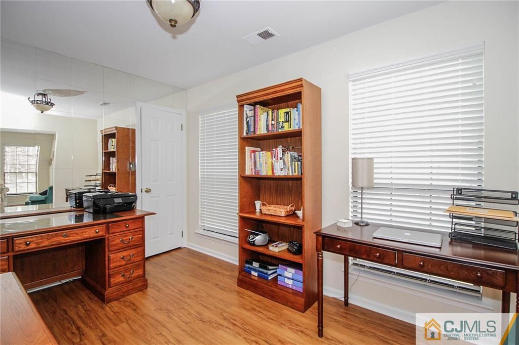 2106 Timber Oaks Road, Unit 2106 Edison, NJ 08820 - Photo 14 of 25 a room with furniture and wooden floor