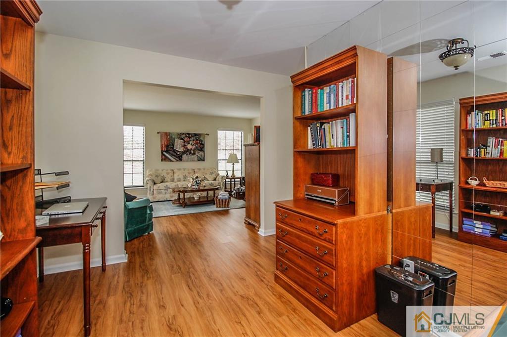 2106 Timber Oaks Road, Unit 2106 Edison, NJ 08820 - Photo 16 of 25 a living room with furniture and a book shelf