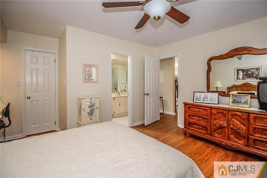 2106 Timber Oaks Road, Unit 2106 Edison, NJ 08820 - Photo 20 of 25 a spacious bedroom with a bed and a dresser