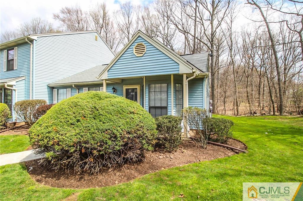 2106 Timber Oaks Road, Unit 2106 Edison, NJ 08820 - Photo 3 of 25 front view of a house with a yard